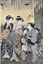 La courtisane Nishikido de la maison de thé Chojya entourée par ses dames. Xylographie format Oban-tate-e cm. 37x26