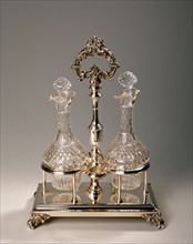 Two bottles and silver metal structure.