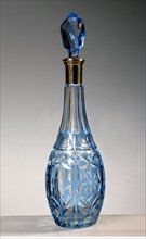 Blue crystal and silver wine bottle.