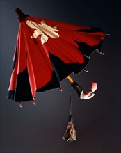 Red and black felt umbrella, with a white stylized star