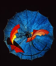 Blue felt umbrella, with geometric decoration in a futuristic style