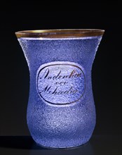 Clear glass souvenir glass with blue glass bead applications (Glasperlen)