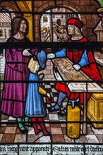 Vitrail de la Vie de saint Eloi : saint Eloi est placé en apprentissage par son père, auprès d'Abbon, orfèvre réputé, à Limoges