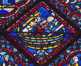 Noé construit l'Arche avec l'un de ses fils (vitrail de Chartres)
