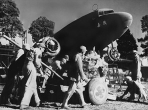 Chinese mechanics work for U.S Air Service Command in China (1944).