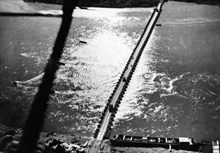 1st U.S Army trucks roll over pontoon bridge (Rhine River-March 21,1945)