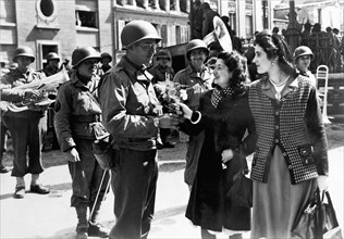 French women welcome Americans at Cherbourg (France) June ,1944.