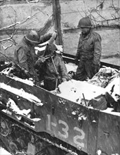 U.S soldiers fire mortar from half-track (Belgium) Begin 1945