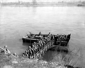 Infantrymen cross the Rhine river in Germany  (March 17, 1945)