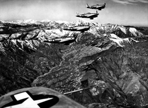 P-47 Thunderbolts fighters bombers fly over high over the Apenines (Italy) April 12, 1945