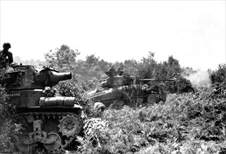 U.S troops open fire near Barenton (France), Summer 1944.