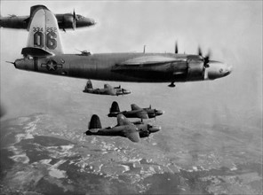 B-26 Marauders in tight formation fly against Germany (1945).
