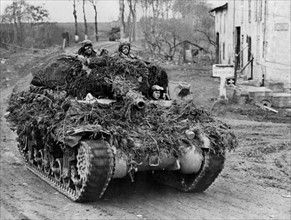 Camouflaged U.S . M-10 tank destroyer advances to front (Eastern France - Autumn 1944)