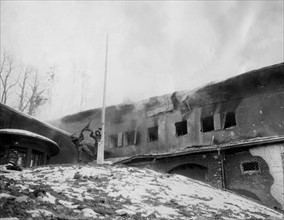 U.S. soldiers rip Nazi flag from Hitler's Berchtesgaden blazing retreat (May 4, 1945)