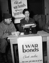 An American officer buys "War bonds" in Paris (France) November 30, 1944.