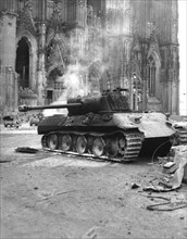 Deserted German tank stands before Cologne cathedral, March 6, 1945