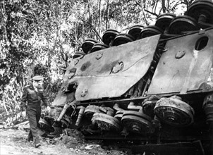 General Eisenhower inspects overturned German tank in France, Summer 1944