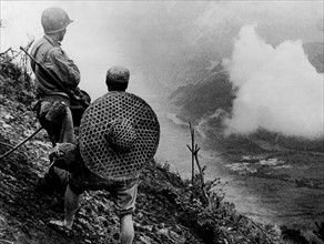 American and Chinese soldier  observe Salween River battle, 1944