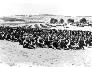 American armored unit are briefed by their commanding officer in England, May 27, 1944