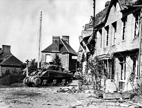 First American tank enters the French town of Perriers, August 1944