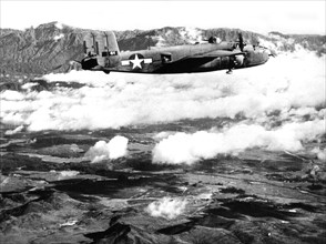 An American B-25 Mitchell bomber over Chinese mountains, 1944
