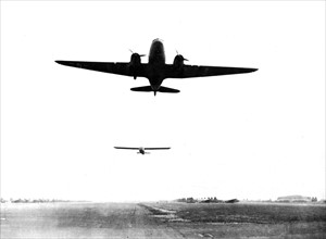 Allied tow plane and glider head for Holland, September 17, 1944