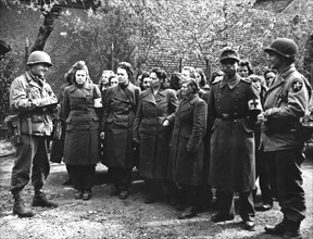 American soldiers question German Army women  near Blosein, April 1945