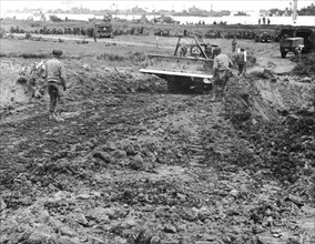 American soldiers build supply road on Normandy beachhead, June 1944