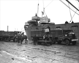 An American Libery Ship is unloaded in Antwerp harbor, May 9, 1945
