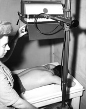 Ultra-violet sun lamp is used at a station hospital in Marseilles, February 6, 1945