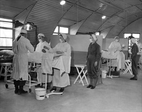 Operating room at the 188th General Hospital in Lison (France) January 6, 1945.