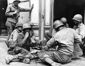 In Cherbourg, Gi's eating their first hot meal (June 1944)
