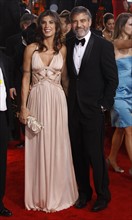 US actor George Clooney and his Italian girlfriend actress Elisabetta Canalis arrive for the 67th