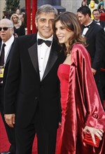 US actor George Clooney and his girlfriend Elisabetta Canalis arrive on the red carpet during the
