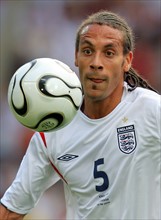 England national soccer player Rio Ferdinand from Manchester United focuses on the ball during the