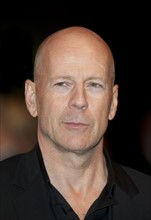 Bruce Willis with Dame Helen Mirren arriving for the European  Premiere of the film RED at the