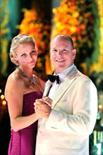 Prince Albert II of Monaco and his wife, Princess Charlene of Monaco, dance at the 63rd Red Cross