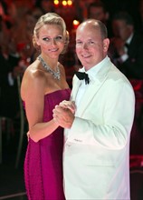 Prince Albert II of Monaco and his wife, Princess Charlene of Monaco, dance at the 63rd Red Cross