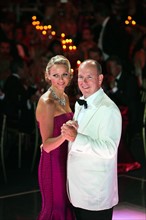 Prince Albert II of Monaco and his wife, Princess Charlene of Monaco, dance at the 63rd Red Cross