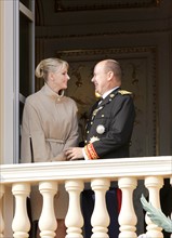Prince Albert II of Monaco and his wife Princess Charlene stand on the balcony of the palace of