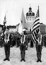 Flag bearers during a military parade at the 'Armed Forces Day' in Berlin