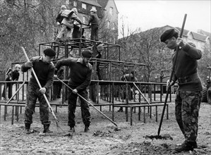 British soldiers cleaning playground in Berlin