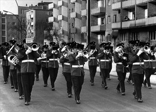 A British military band marches through Berlin