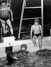 Canadian soldiers exercise in indoor swimming pool