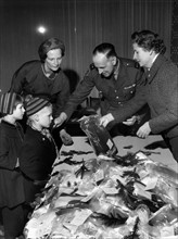 The French military governor of Berlin Jean Lacomme gives Christmas presents to children