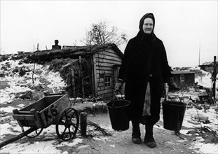 Postwar period: Refugee women on a farm