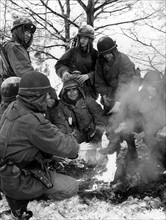 US soldiers at warming fire