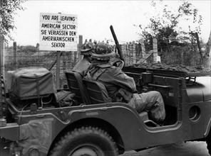 Soldiers in jeep on the way to a manoeuvre of US army in Grunewald in Berlin