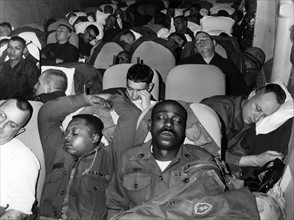 Sleeping soldiers on their way to Germany to participate in the manoeuvre REFORGER I