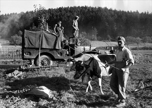 German farmers surrounded by American military maneuvers